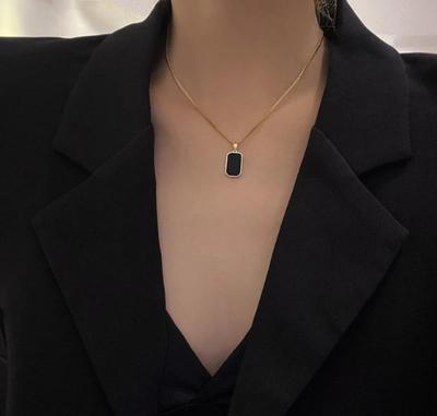 Gold Plated Black Stone Pendant - Close-up of Intricate Bezel Onyx Gemstone Setting