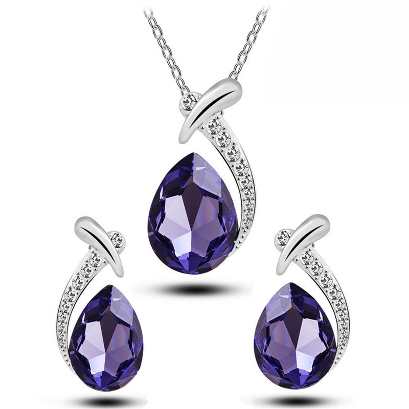Blue Crystal Water Drop Pendant and Earrings Set - Macro View of Shimmering Halo Accent Crystals