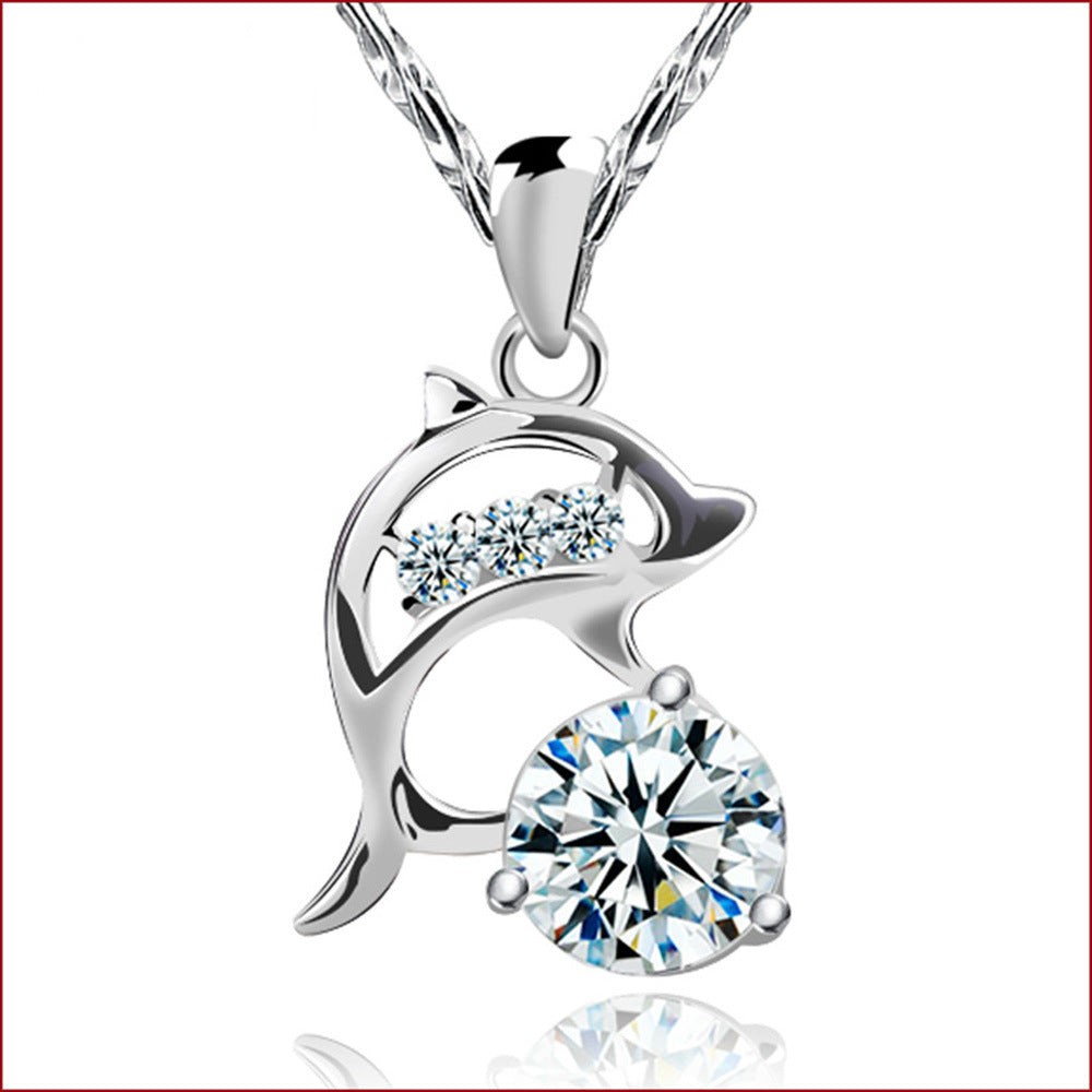 Silver Plated Dolphin Necklace - Close-up of Leaping Marine Charm Crystal Settings