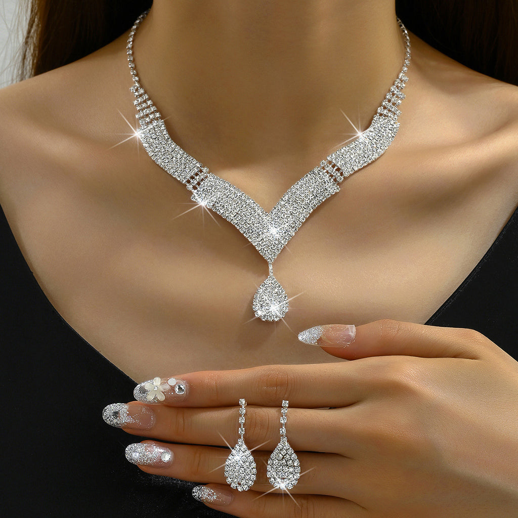 V-Neck Diamond Necklace and Earrings Set - Close-up of Intricate Angular Prong Crystal Layout