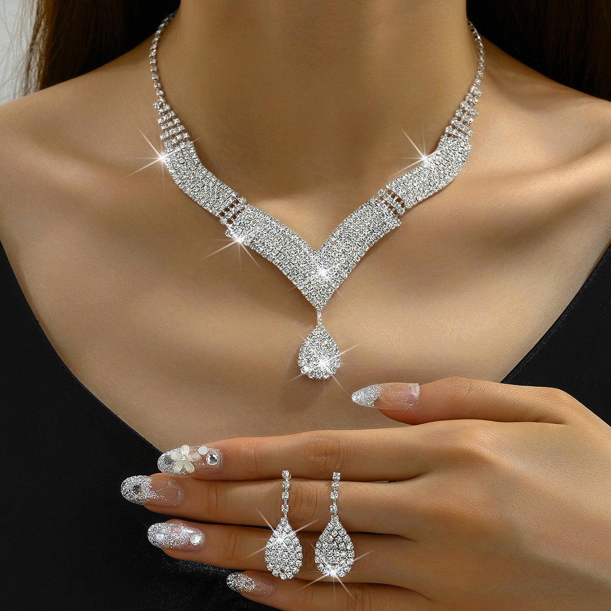 V-Neck Diamond Necklace and Earrings Set - Close-up of Intricate Angular Prong Crystal Layout